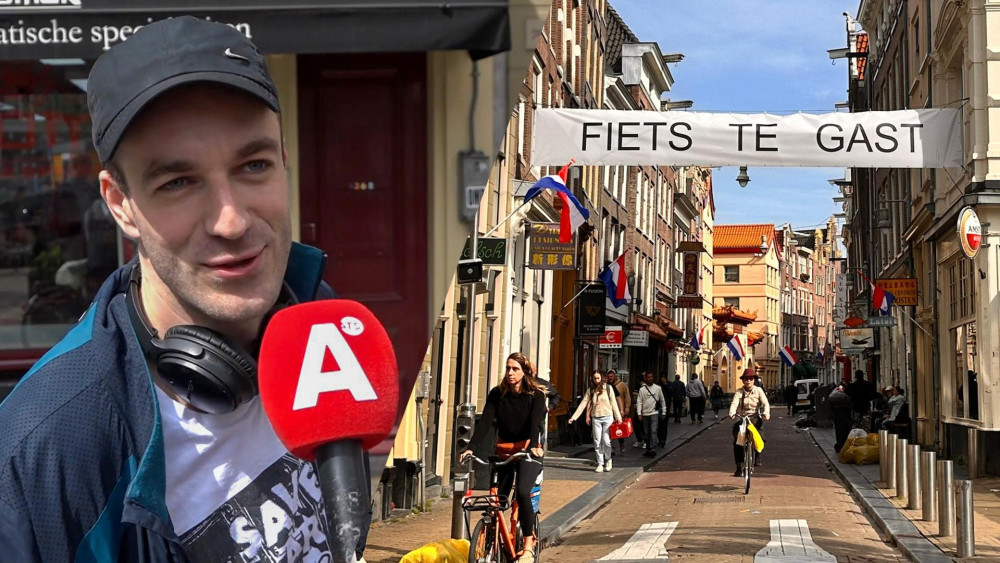 Onbekende statementmaker hangt 'fiets te gast' doeken op bij Zeedijk: "Toeristen letten niet op"